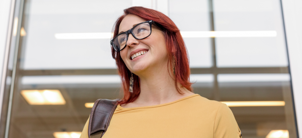 Woman wearing glasses and smiling