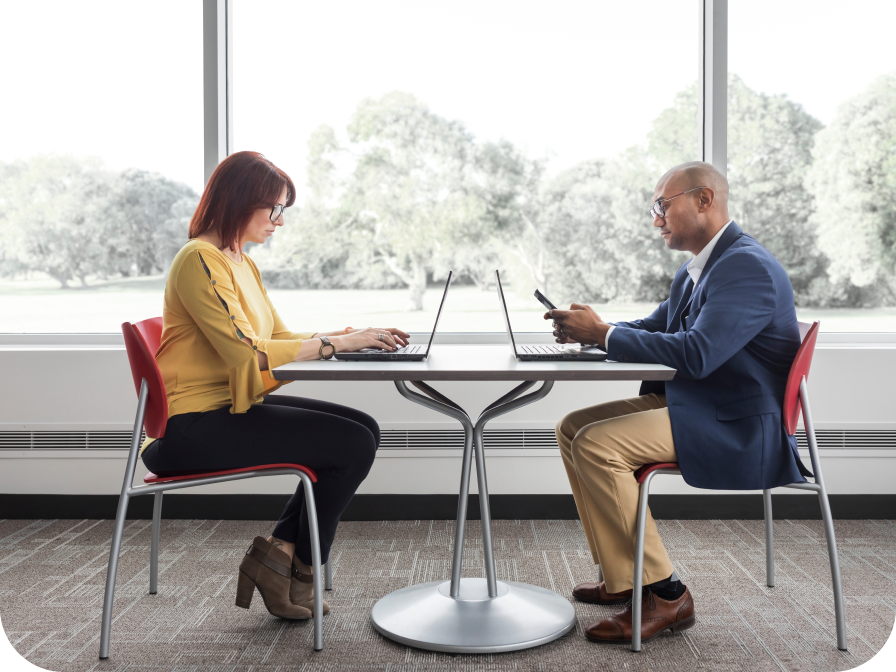 Man and woman on laptop