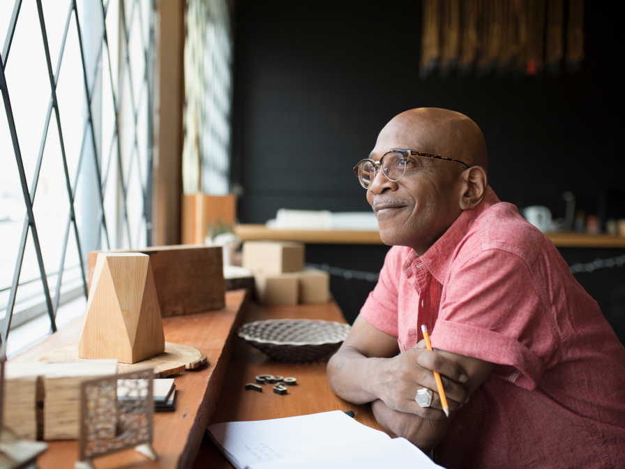 Man looking out the window smiling