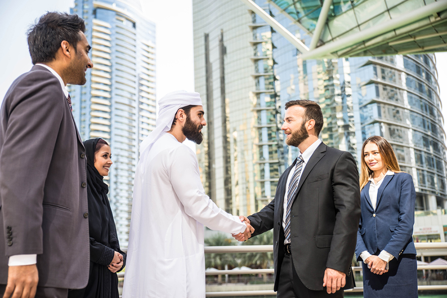 Two men shaking hands in Dubai