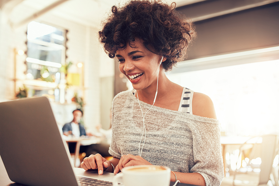 Woman smiling while on laptop